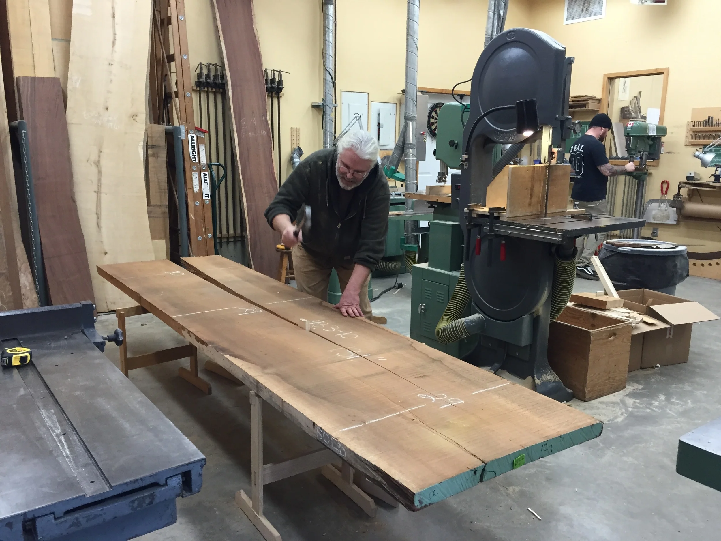  Robert splits a plank of Doussie along an existing crack, for easier storage 